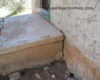 Separating landscaping from short foundation and low wood siding ...